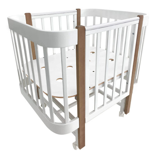 Кроватка детская Indigo Italiano Baby продольный маятник на колесах